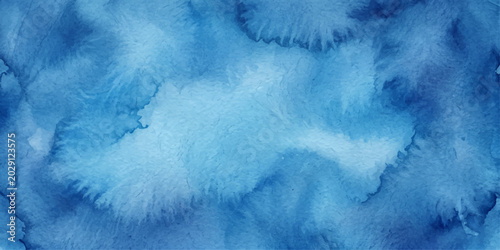 Fotografie An abstract watercolor background in varying shades of blue
