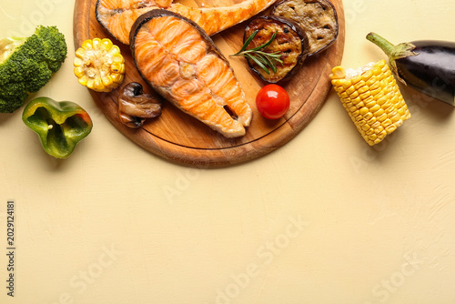 Wooden board with tasty gri...