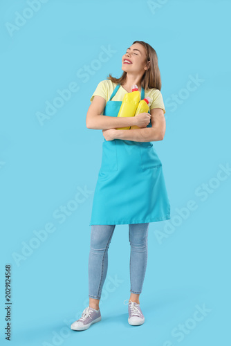 Young woman with bottles of...