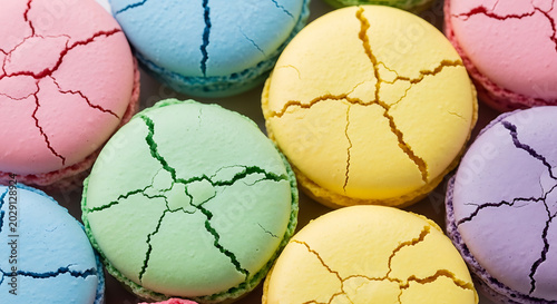 Cracked colorful macarons closeup