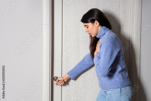 Young woman having panic at...
