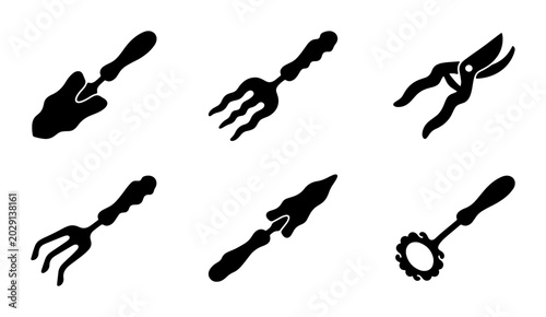 Konstfotografi Collection of black silhouette garden tools including shovel, fork, pruners, and