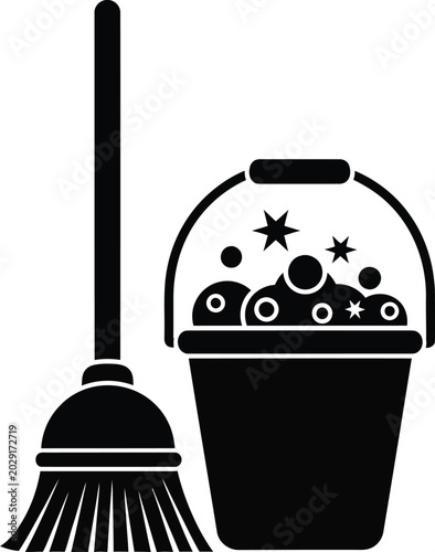 Tableau sur toile Black of a bucket with soapy water and a broom cleaning bubbles