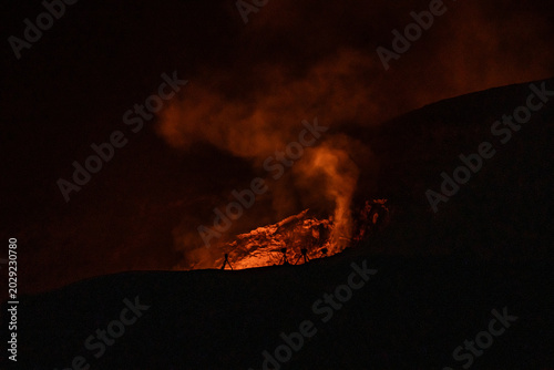 Obraz na płótnie Sulfur dioxide emissions from the Halema`uma`u vent, glows at night