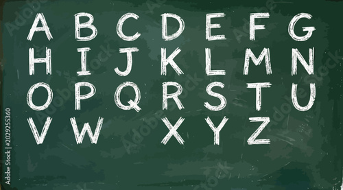 Fotografija Alphabet letters written in white chalk on a green chalkboard background
