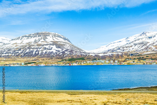 Harbor and ships in town of Reydarfjordur in east Iceland on sunny spring day
