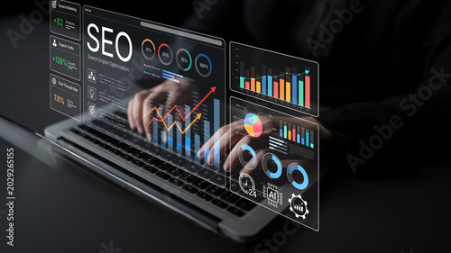 Foto Modern Digital Workspace with Hands Typing on Laptop Surrounded by Interactive Charts and Graphs for Search Engine Optimization Analysis