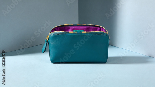 Luxurious Teal Leather Makeup Bag with Vibrant Purple Interior, Stylish and Practical Accessory for Beauty Essentials