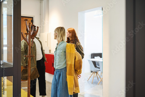 Photos Team arriving at modern office entrance