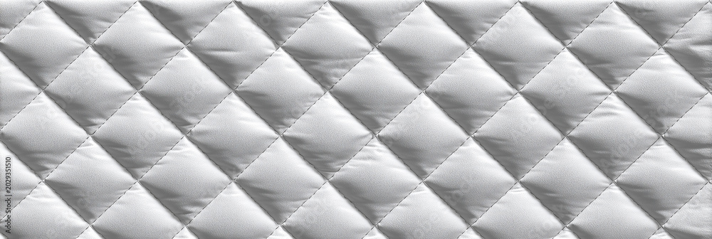 Naklejka premium wide panoramic background of white quilted fabric with diamond stitch pattern