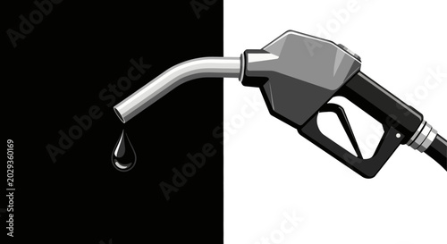 Fuel nozzle dripping gasoline on black.