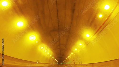 Driving through a dimly lit urban tunnel