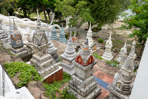 Fotografie Traditional colorful Thai Buddhist graves and stupas at a temple