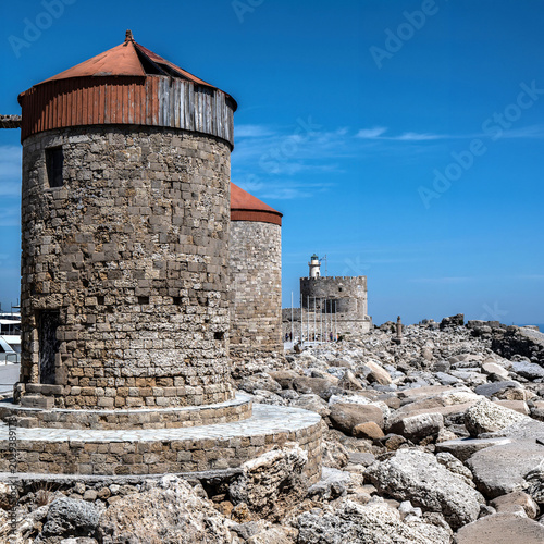 The windmills in Mandraki Harbor in Rhodes Town, built by the Order of Saint John in the 14th and 15th centuries.