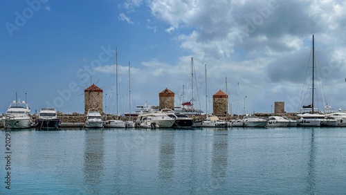 The windmills in Mandraki Harbor in Rhodes Town, built by the Order of Saint John in the 14th and 15th centuries.