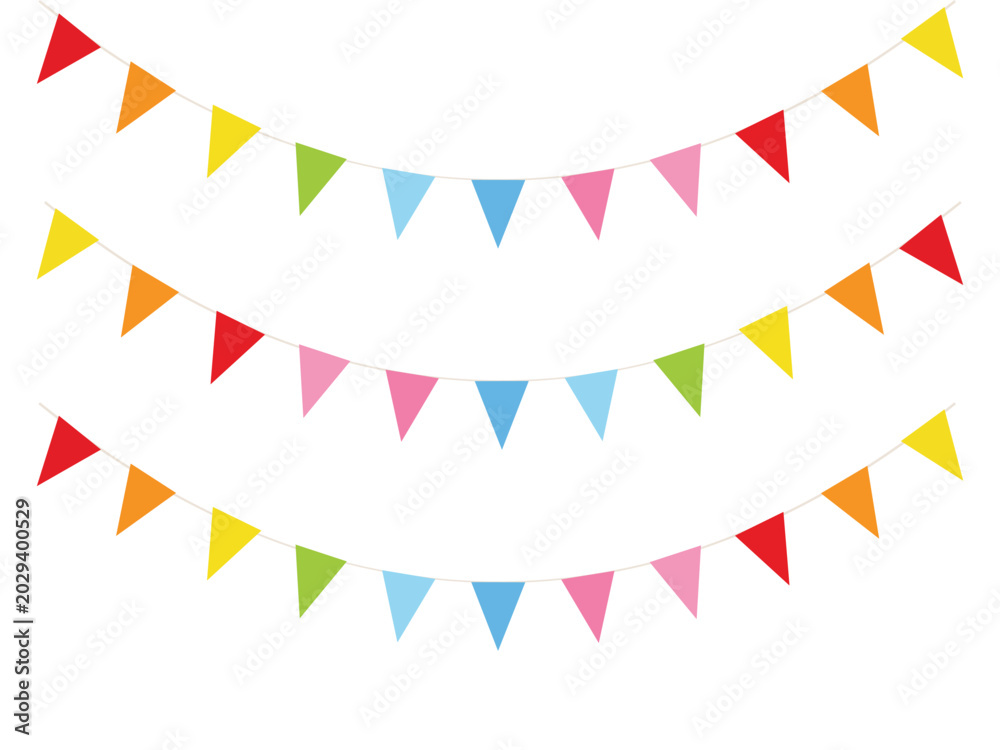 Fototapeta premium Vibrant multicolored triangular pennant banners on strings for party decoration