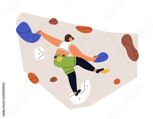 Happy woman bouldering on indoor climbing wall, hanging, grabbing holds, arti...