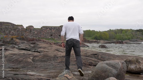 man walking on the beach
