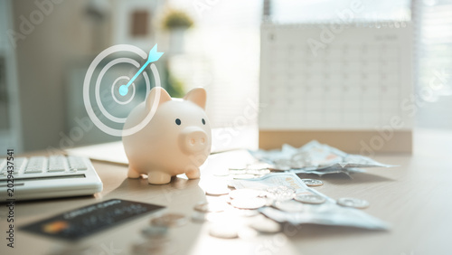 Piggy bank with money, calendar, calculator, and target icon, showing savings goal, budget progress, emergency fund, retirement planning, and personal finance concept.