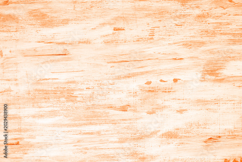 Orange distressed wooden background with rustic texture and weathered paint pattern