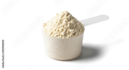 A white scoop holds a pile of light beige protein powder. The scoop is white with a silver handle.