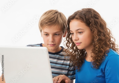 Young boy and girl using a laptop isolated on white background