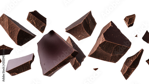 Foto Dark chocolate chunks flying and breaking apart