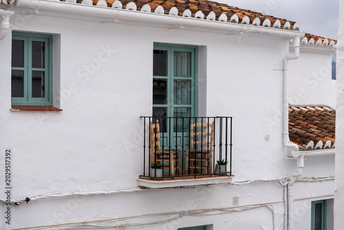 Valokuva Traditional White Spanish House Balcony with Rustic Roof Tiles