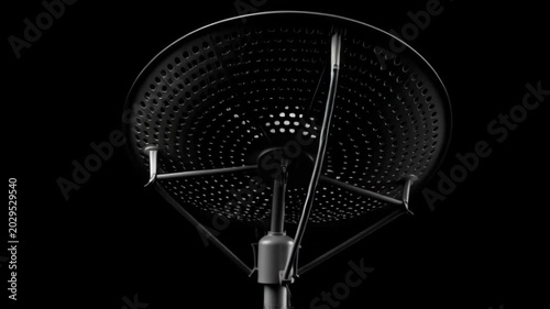 High gain satellite dish antenna silhouetted against a dark background for communication and signal reception.