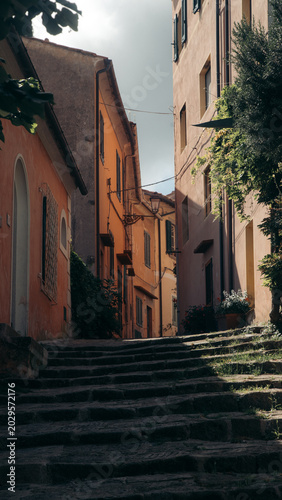 Idyllic street scene with colourful houses in the village of Marciana, Isola d'Elba, Tuscany, Italy