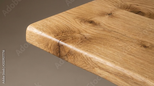 Close-up view of a wooden table edge showcasing natural grain patterns and smooth finish, highlighting craftsmanship and quality of the wood material