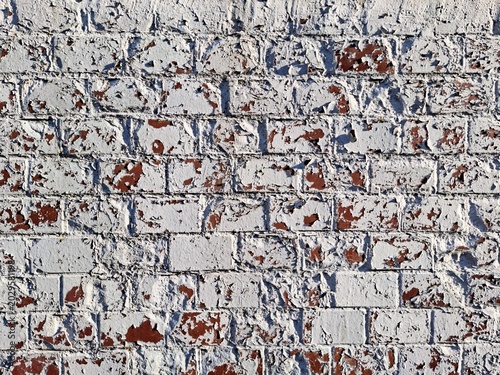 Old White Painted Brick Wall Texture with Chipped and Peeling Paint