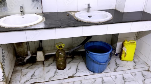 Washroom Interior with Cleanliness Items, Hygiene Products, Sanitation Equipment, Bathroom Accessories and Modern Cleaning Supplies Arrangement Scene