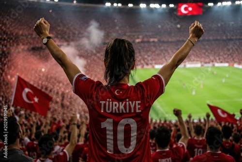 Excited fan cheering for the turkish national football team at stadium