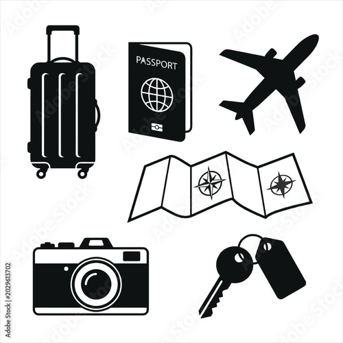 Travel essentials laid out for a trip abroad with luggage