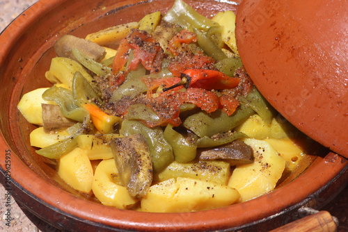 A close-up shot of a moroccan tajine with vegetables, traditional food