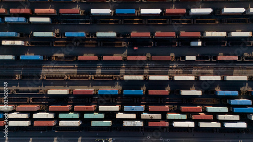 Obraz na plátně Top down aerial view of freight trains in railway yard