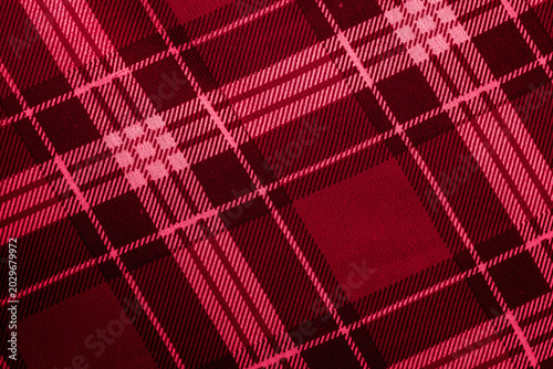 Red and dark maroon plaid fabric texture with checkered tartan pattern