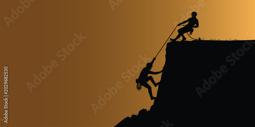 Foto Two rock climbers helping each other up a steep cliff face at sunset