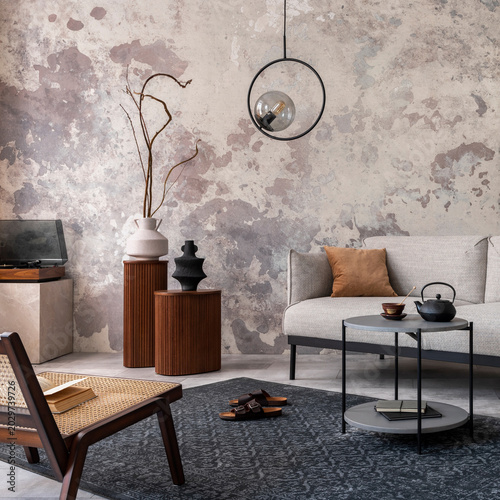Slika na platnu Loft style of modern apartment with grey design sofa, armchairs, ladder, black coffee table, black ladder, pedant lamp, carpet, decoration and elegant accessories