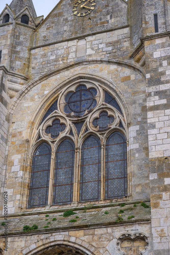 Obraz premium The Church of Notre-Dame de Puiseaux is an imposing 13th-century Gothic church, famous for its distinctive spiral spire and historical significance, France