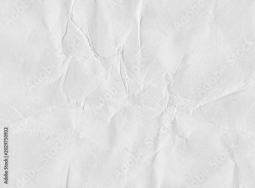 Crumpled paper texture with irregular wrinkles, intersecting creases, compressed center folds, and natural fiber detail, expressive scanned sheet surface for collage and graphic work