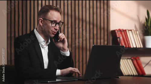 Professional man in suit making phone call at desk, attorney service, business negotiation and legal consultation concept, showing legal advice, business consultation