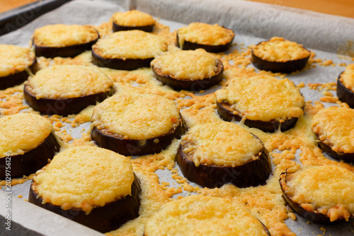 Sliced eggplant with cheese appetizer on baking paper