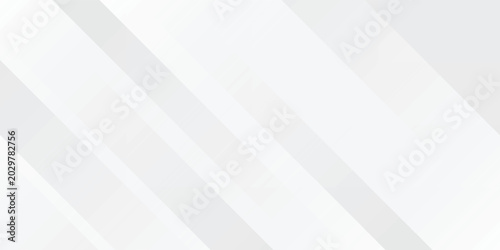 Abstract white and grey background with overlapping diagonal geometric stripes. Modern minimalist sleek design featuring bright light silver tones and clean subtle shapes.