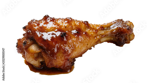 Quadro su tela Glossy glazed chicken wing drumstick with crispy brown skin, isolated on transpa