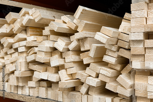 Stacked lumber in a workshop storage area