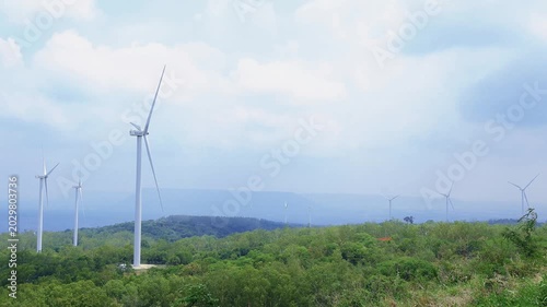 EGAT wind turbines at Khao Yai Thiang  on a misty day generating green energy for the city, Nakhon Ratchasima, Thailand