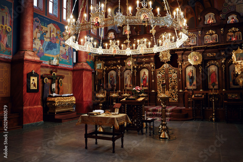 Photos Orthodox church interior with iconostasis and chandelier