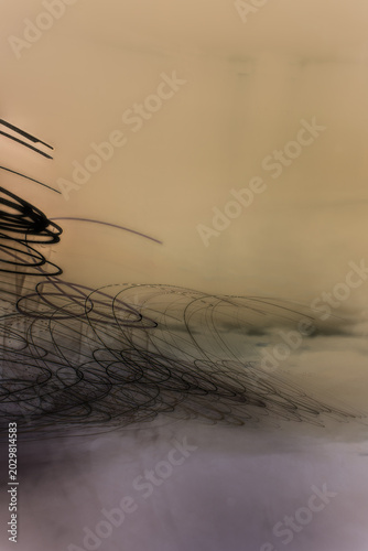 Fotografie Dark Spiral Lines on an Abstract Ochre Background